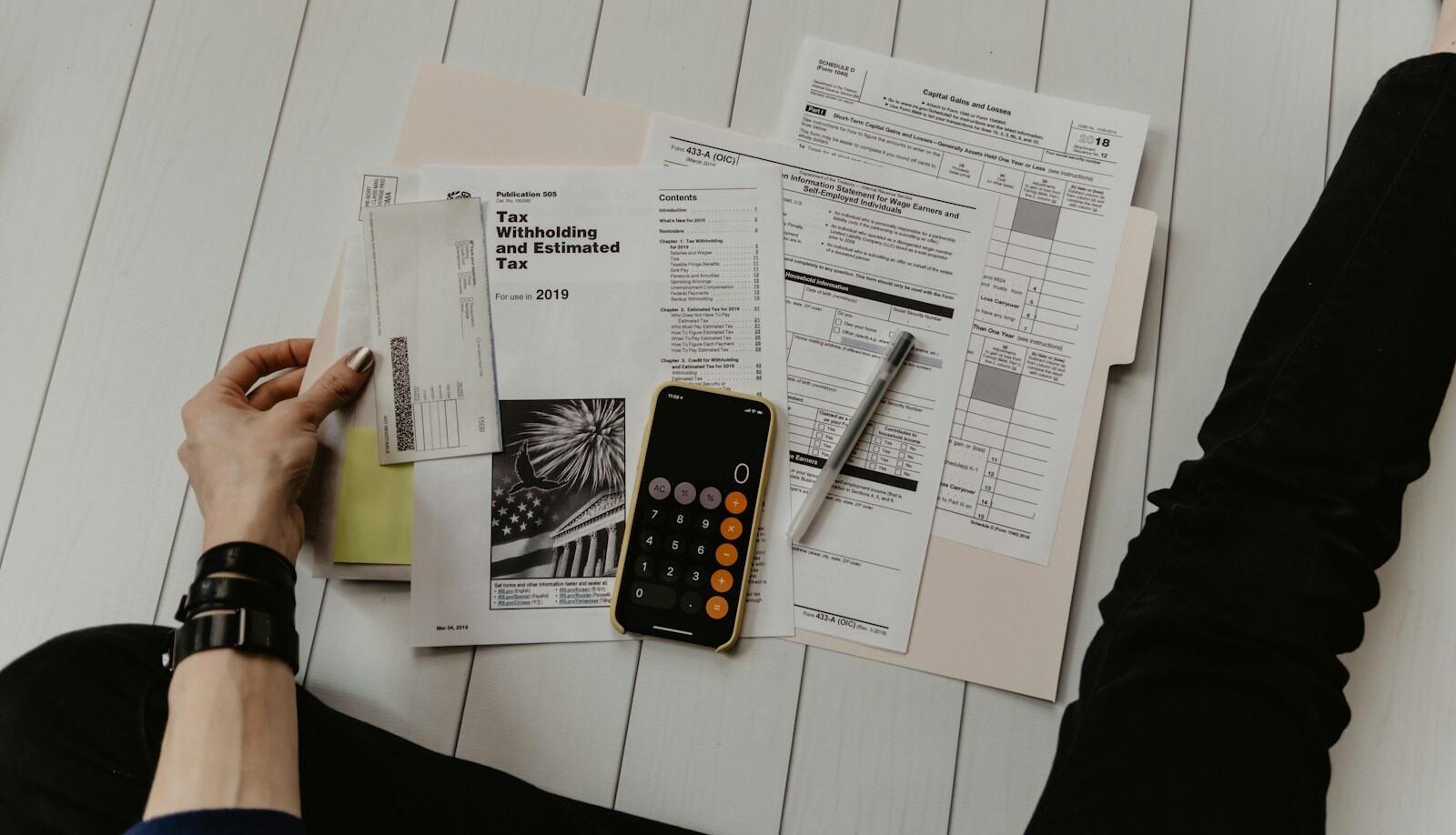 Documents and a calculator on a desk