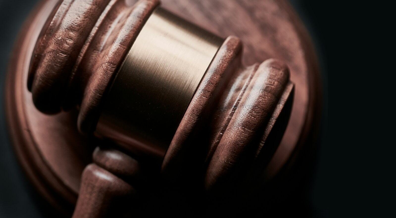 Judge's gavel on a wooden desk
